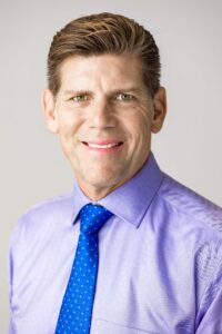 Professional Headshot of man on neutral backround